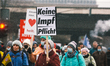 a sign of "no mandatory of vaccination" is seen during the Anti vaxxers  weekly demonstrat...