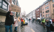 counter anti vaxxers are seen holding signs to confront with anti vaxxers joins demonstrat...