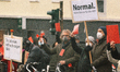counter anti vaxxers are seen holding red card confronting with anti vaxxers joins demonst...