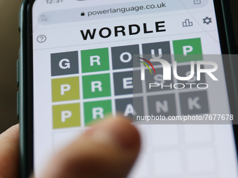 Wordle game displayed on a phone screen is seen in this illustration photo taken in Krakow, Poland on January 23, 2022. (