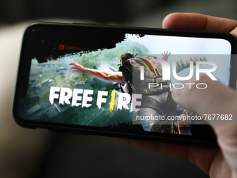Garena Free Fire logo displayed on a phone screen is seen in this illustration photo taken in Krakow, Poland on January 23, 2022. (