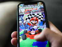 Mariokart Tour logo on the App Store displayed on a phone screen is seen in this illustration photo taken in Krakow, Poland on January 23, 2...