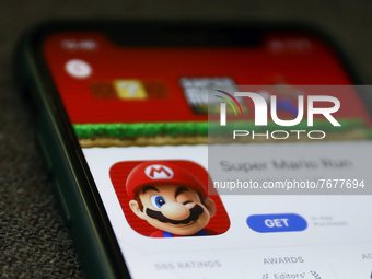 Super Mario Run logo on the App Store displayed on a phone screen is seen in this illustration photo taken in Krakow, Poland on January 23,...