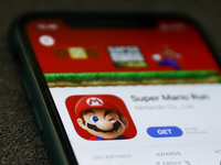 Super Mario Run logo on the App Store displayed on a phone screen is seen in this illustration photo taken in Krakow, Poland on January 23,...