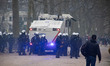 Police fire tear gas against the violent demonstrators and sprays them with the water cann...