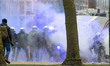 Police fire tear gas against the violent demonstrators and sprays them with the water cann...