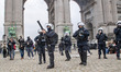 Police officer using tear gas. Thousands Protest during the European Demonstration for Dem...