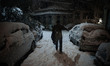 A man is walking through the snow at Pagrati neighborhood of Athens, in Athens, Greece, on...