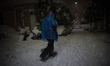 A man is walking through the snow at Pagrati neighborhood of Athens, in Athens, Greece, on...