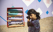 Little refugee girl as seen playing in the camp. Inside the new Refugee camp in Samos isla...