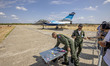 Crew from the French Solo Display team sells souvenirs from the Rafale. A French air force...