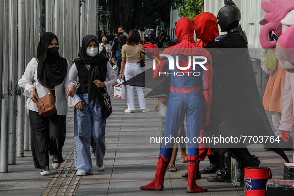 Cosplayer dressed as super heroes is seen near Gedung Merdeka Tourism Area on January 29, 2022 in Bandung, Indonesia. Based on data from the...