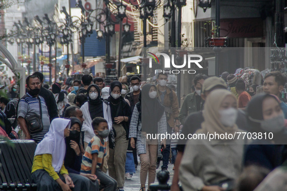 People wearing a protective mask are seen walk in a shopping area on January 29, 2022 in Bandung, Indonesia. Based on data from the Global I...