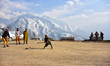 Boys play cricket on Zabarwan mountain range on the outskirts of Srinagar, Indian Administ...