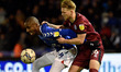 Oldham Athletic's Dylan Bahamboula tussles with Max Clark of Rochdale Association Football...