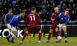 Oldham Athletic's Callum Whelan tussles with Alex Newby of Rochdale Association Football C...