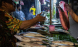 A milkfish vendor and buyer in Rawa Belong, Jakarta on 30 January 2022. Nearing the Chines...