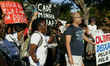 The families and activists came together for a protest in the streets of Rio de Janeiro. T...