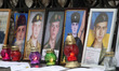 Photos of dead Ukrainian soldiers are seen during a rally of parents in front of the Presi...