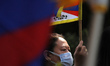 A Tibetan woman attends a march towards Chinese embassy during a protest against Beijing W...