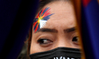 A Tibetan woman attends a march towards Chinese embassy during a protest against Beijing W...