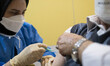 An Iranian man receives a dose of the new coronavirus disease (COVID-19) vaccine during th...