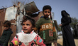 Palestinian children play in front of their house in the Bedouin village of Um Al-Nasr in...