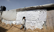 A Palestinian girl walks near her family's house, in the Bedouin village of Um Al-Nasr in...
