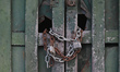 A chain on a door to a local business in Merida center.On Sunday, February 13, 2022, in M...