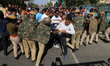 Police personnel try to stop BJP activists during their protest demanding CBI probe into R...