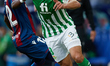 Nabil Fekir (R) of Real Betis competes for the ball with Mickael Ramon Malsa of Levante UD...