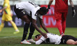 Simy Nwankwo (Parma Calcio 1913) helps a teammate on the ground during the Italian soccer...