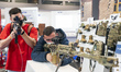 Some young people test different weapons at the SICUR 2022 International Security Show tha...