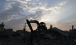 Palestinian workers remove the debris of a house, that witnesses said was destroyed by Isr...