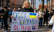 Protesters protest with placards in the square in front of the Municipality of Bari agains...