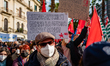 Protesters protest with placards in the square in front of the Municipality of Bari agains...
