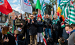 Protesters protest with placards in the square in front of the Municipality of Bari agains...