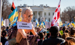 A protester carries an effigy of Russian President Vladimir Putin, mocking the infamous ph...