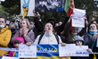 Large group of people gathered in the streets of Lisbon for a human cord for Peace in soli...