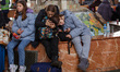 People evacuated from Ukrainian cities under fire from the Russian army wait for a train t...