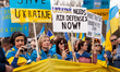 Protesters call for a no-fly zone over Ukraine during a rally at the White House.  Thousan...