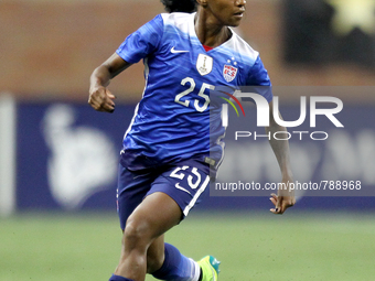 US defender Crystal Dunn carries the ball up there field during the first half of the International Friendly match between the United States...