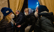 Ukrainians just got off the bus that traveled 2000 km to save them from the war, on 11 Mar...