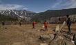 A Kashmiri boy tries to catch a ball as they play in Kupwara in Jammu and Kashmir India on...
