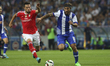 Benfica's Greek midfielder Andreas Samaris and Porto's Itaian forward Pablo Osvaldo in act...