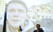 A Ukrainian civilian speaks via video call from the city of Zhytomyr during a press confer...