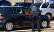 A Washington, D.C resident asks a Metropolitan Police Department officer how to enter the...