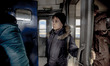 A boy as seen entering the train to leave the country due to the war, as seen waiting the...