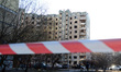 Caution tape seals off a residential building in Sviatoshynskyi district affected by the s...