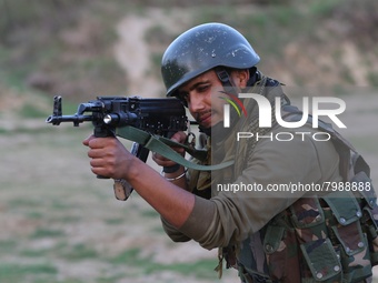 Indian army soldiers take position during CASO Cordon And Search Operation drill in South Kashmir's Kulgam District, Jammu and Kashmir, Indi...
